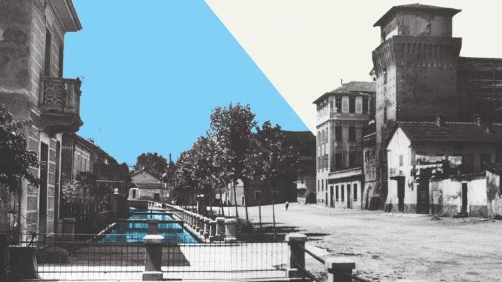 Fotografia in bianco e nero elaborata digitalmente: torre medievale, villini e canale 