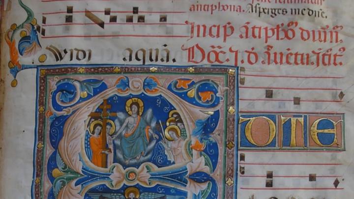 Particolare di capolettera "A" miniato nel Trecento da Giovannino da Genova, con raffigurazione del Giudizio Universale. Vercelli, Biblioteca del Museo Leone Iniziale miniata da antico codice trecentesco, notazione musicale gregoriana